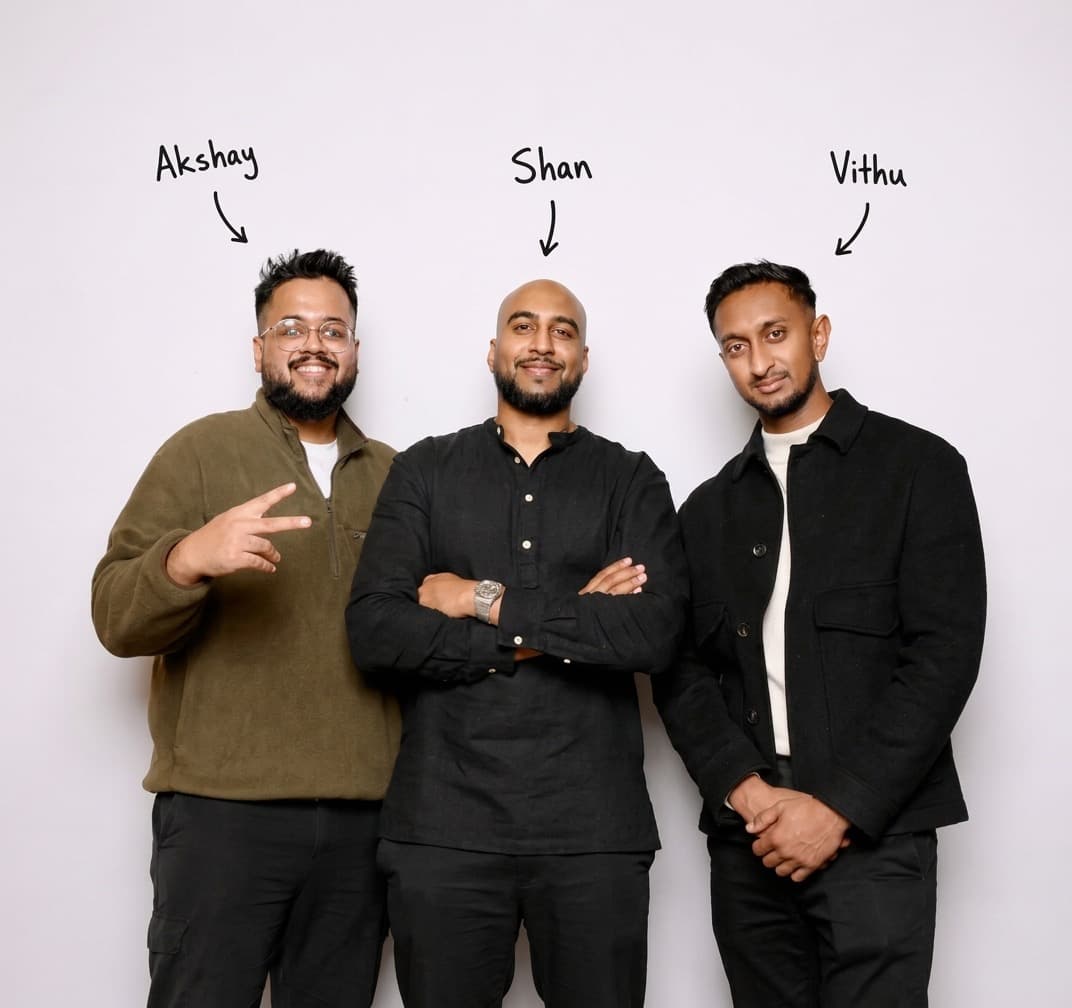 Akshay, Shan and Vithu, the three-person team behind Saffron Media, standing together against a white backdrop